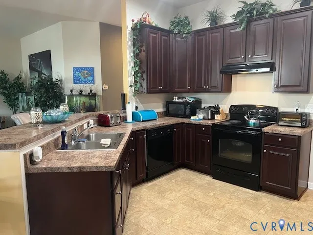 a kitchen with a sink stove and cabinets