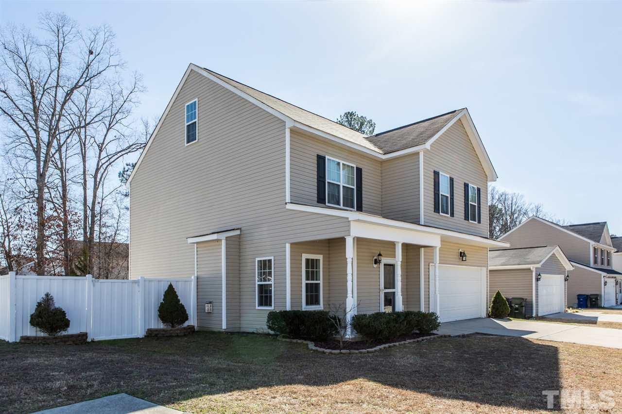 2905 Smooth Stone Trail Raleigh, NC 27610 - Photo 1 of 29 a front view of a house with a yard