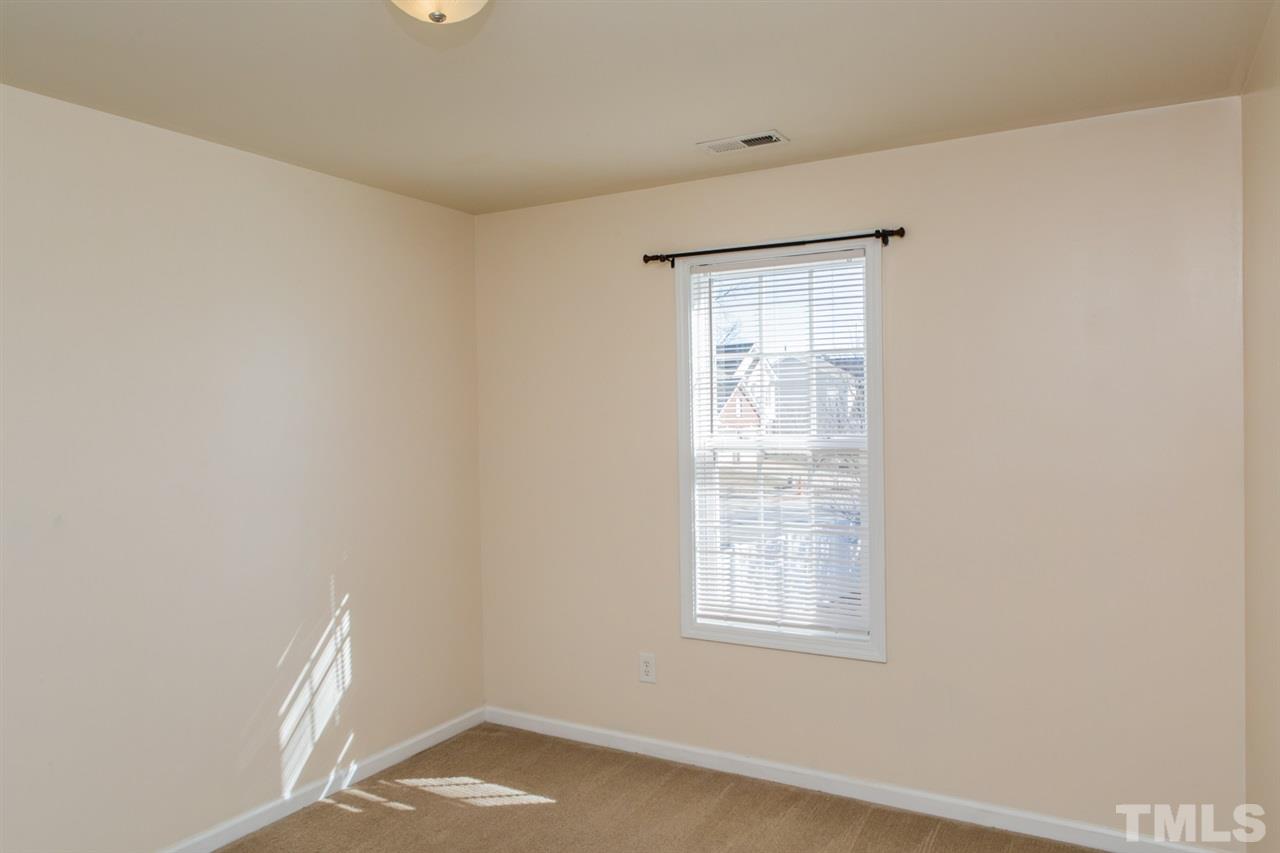 2905 Smooth Stone Trail Raleigh, NC 27610 - Photo 14 of 29 an empty room with a window