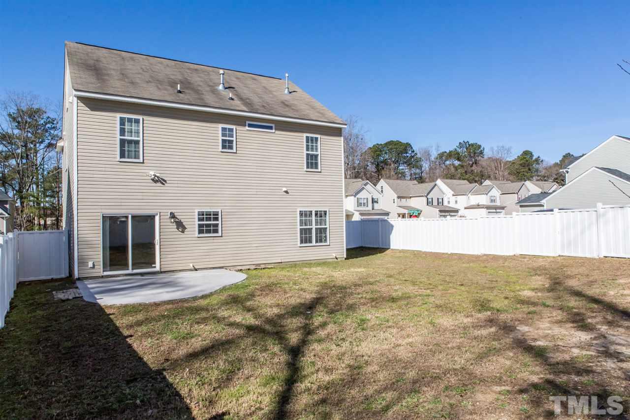 2905 Smooth Stone Trail Raleigh, NC 27610 - Photo 22 of 29 a view of a house with a yard