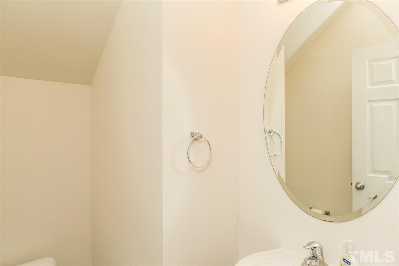 2905 Smooth Stone Trail Raleigh, NC 27610 - Photo 8 of 29 a bathroom with a mirror and a shower
