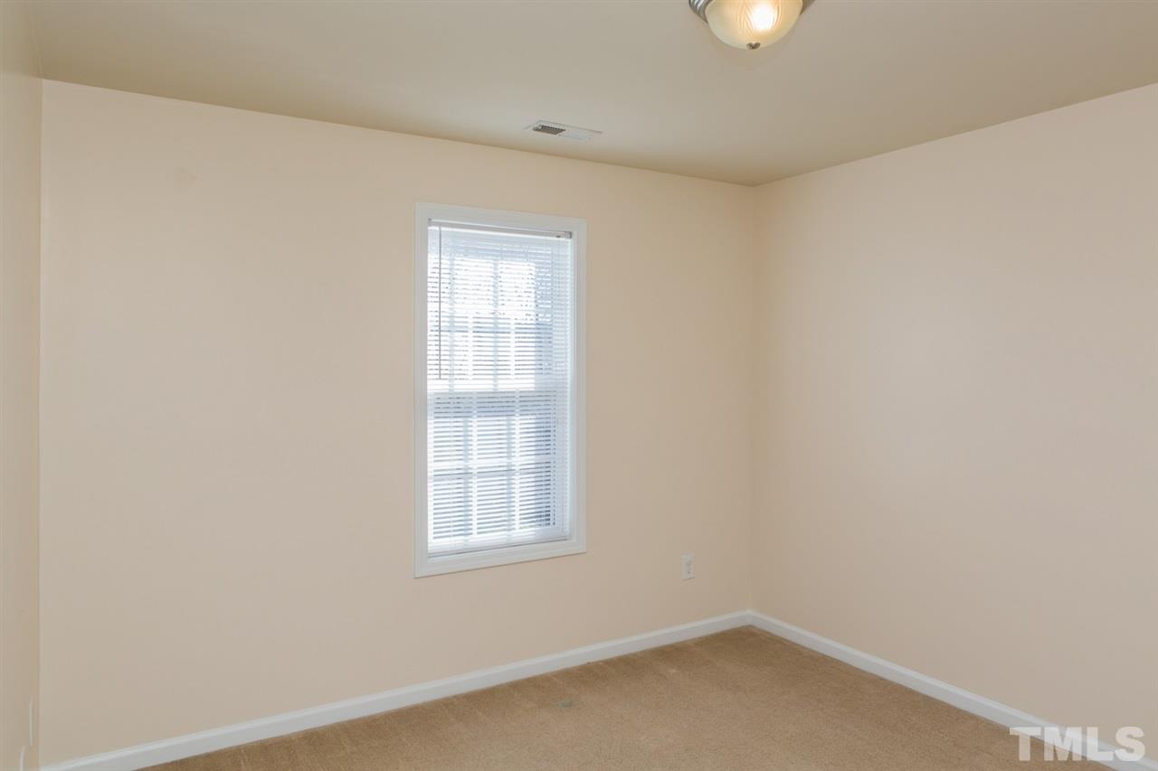 2905 Smooth Stone Trail Raleigh, NC 27610 - Photo 10 of 29 an empty room with window