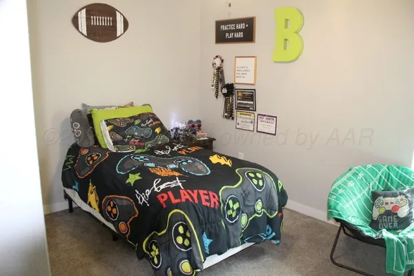 a bedroom with two bed and a window