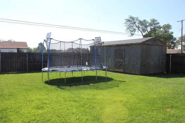 a view of a backyard with a small pool