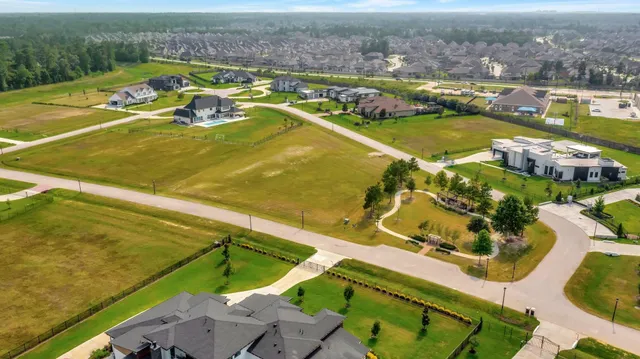 an aerial view of a house with a swimming pool