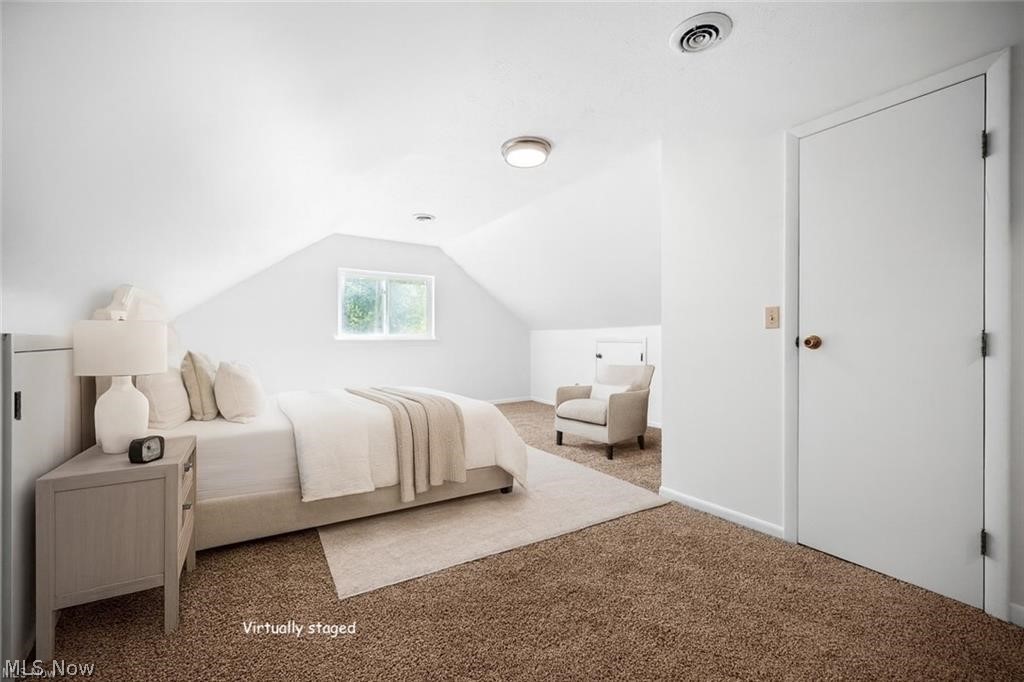 28300 Aurora Road Solon, OH 44139 - Photo 19 of 36 Spacious room featuring sloped ceilings, a single window, and plush carpet flooring