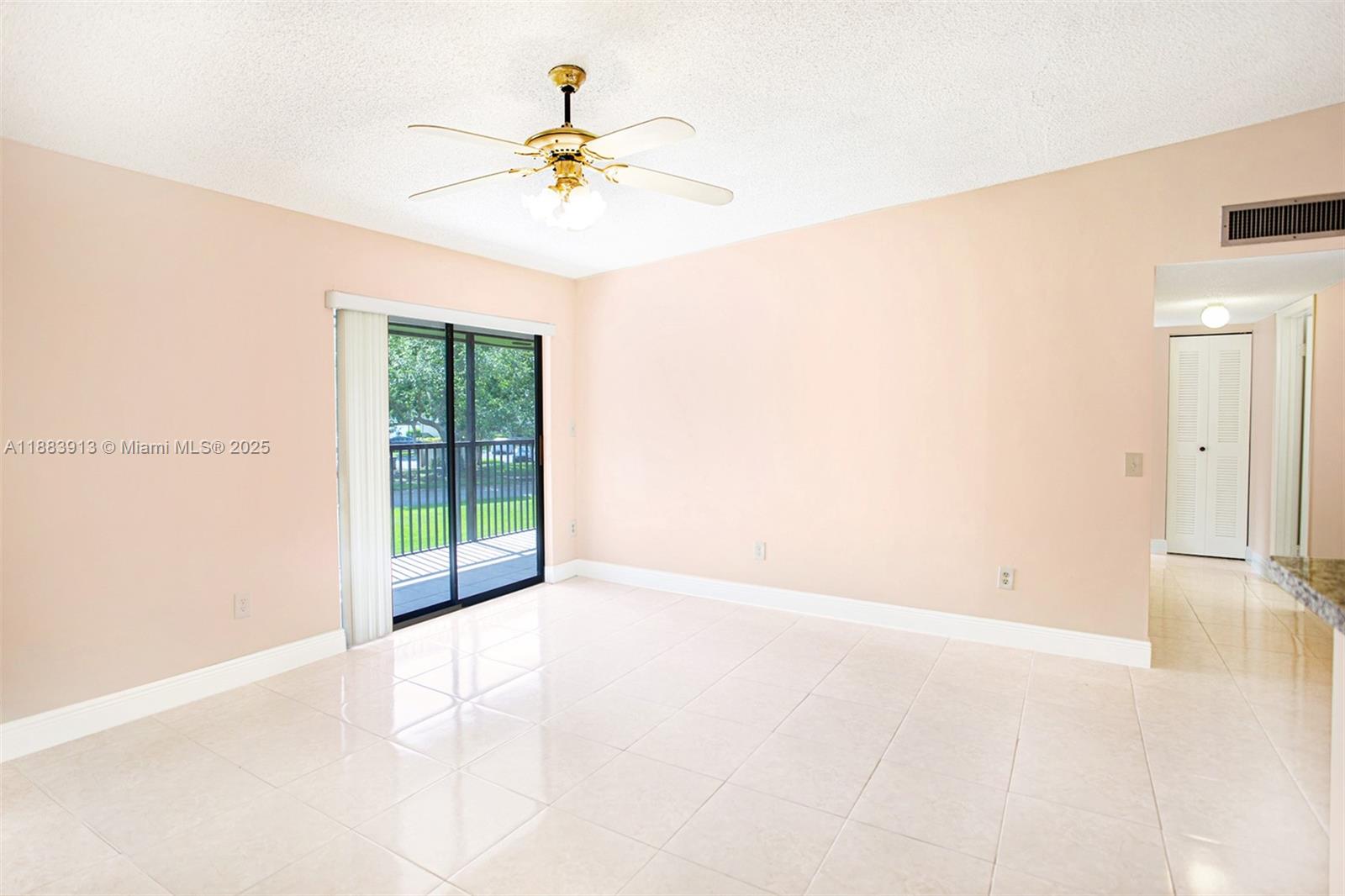 9711 West McNab Road, Unit 203 Tamarac, FL 33321 - Photo 1 of 37 a view of an empty room with a window