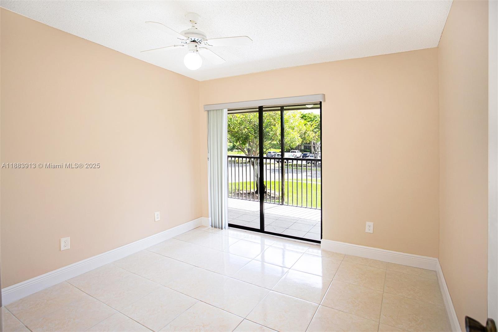 9711 West McNab Road, Unit 203 Tamarac, FL 33321 - Photo 12 of 37 a view of an empty room with a window