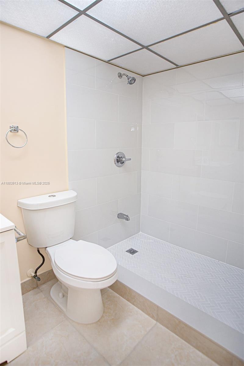 9711 West McNab Road, Unit 203 Tamarac, FL 33321 - Photo 15 of 37 a bathroom with a toilet and a shower