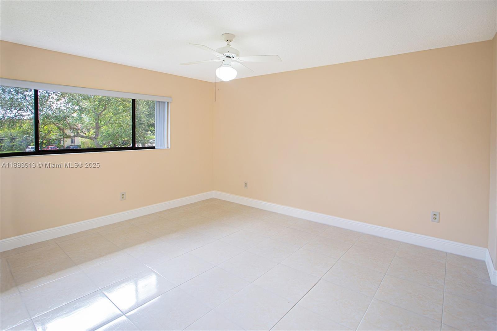 9711 West McNab Road, Unit 203 Tamarac, FL 33321 - Photo 17 of 37 a view of an empty room with a window