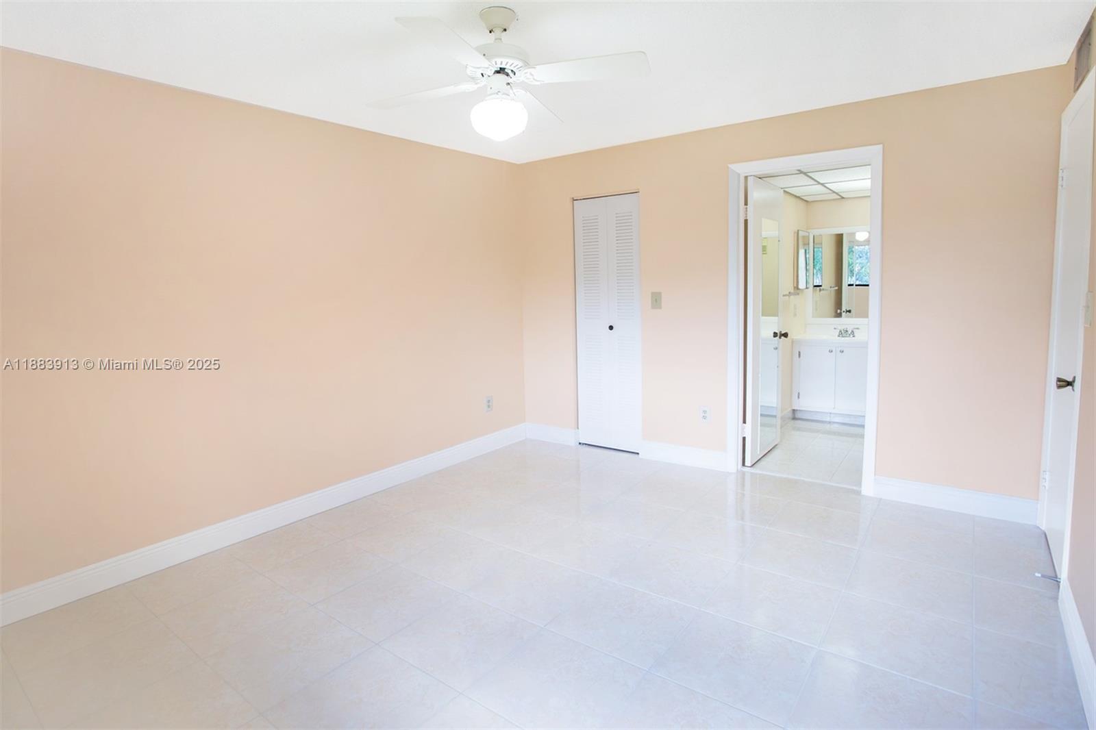 9711 West McNab Road, Unit 203 Tamarac, FL 33321 - Photo 18 of 37 an empty room with a bathroom