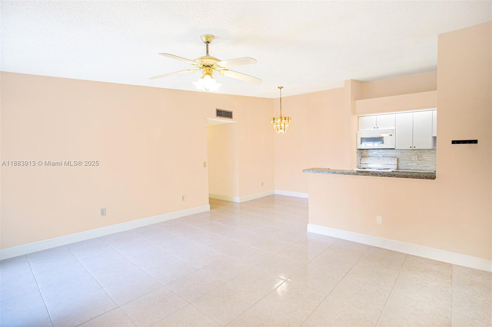 9711 West McNab Road, Unit 203 Tamarac, FL 33321 - Photo 2 of 37 a view of a room with an empty space