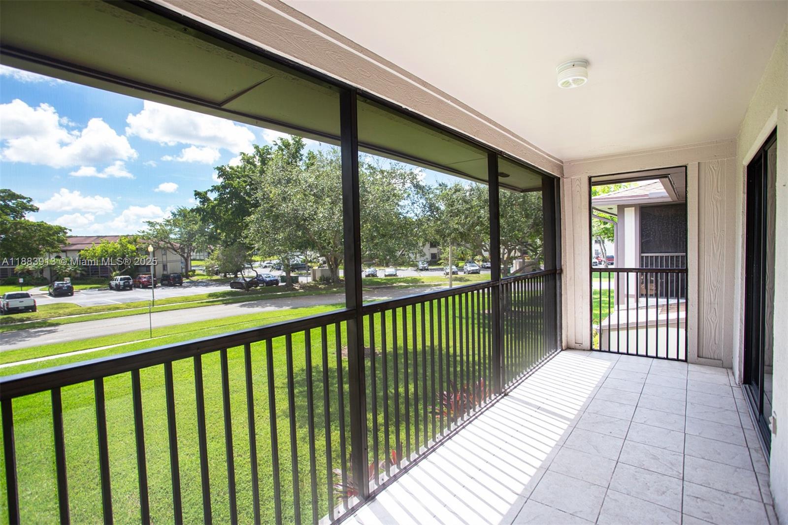 9711 West McNab Road, Unit 203 Tamarac, FL 33321 - Photo 24 of 37 a view of a balcony with wooden floor
