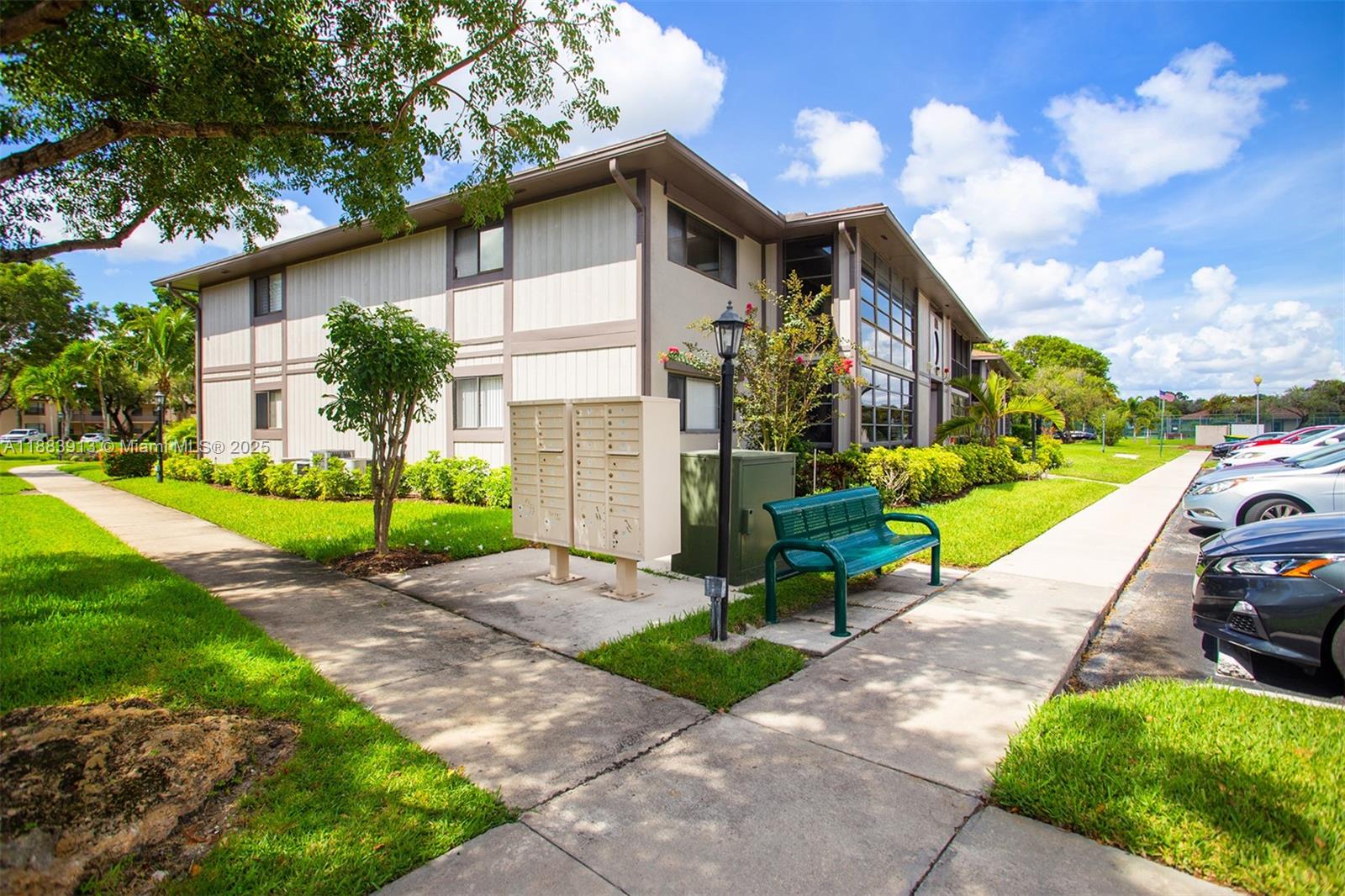 9711 West McNab Road, Unit 203 Tamarac, FL 33321 - Photo 30 of 37 a view of a house with a yard