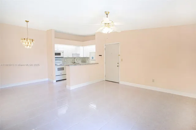 a view of a kitchen with a sink and cabinet
