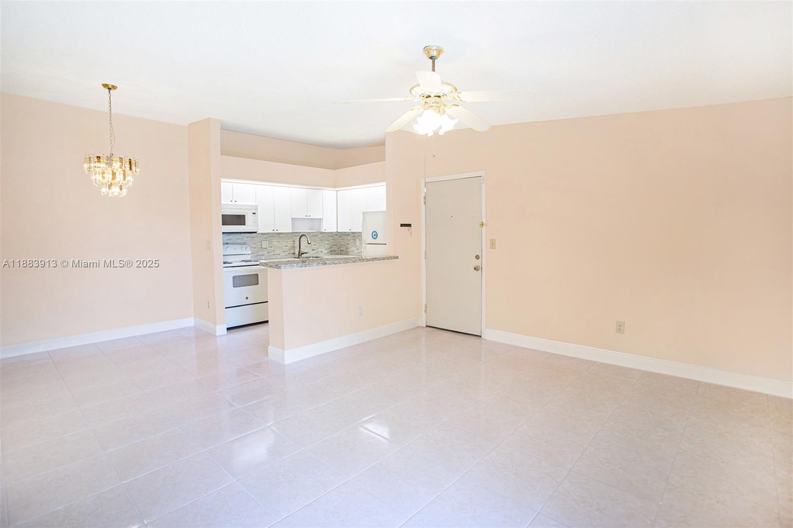 9711 West McNab Road, Unit 203 Tamarac, FL 33321 - Photo 3 of 37 a view of a kitchen with a sink and cabinet