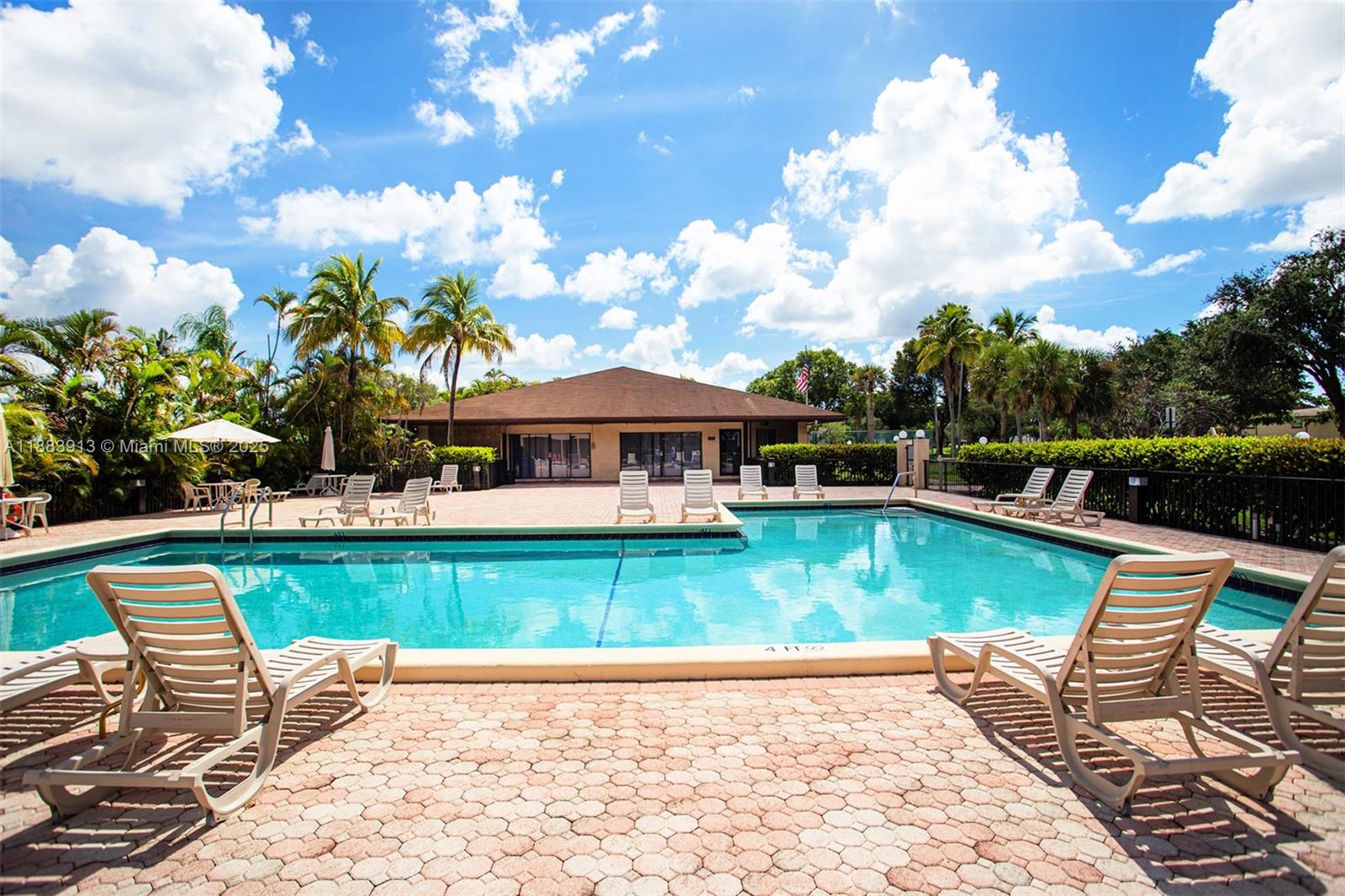 9711 West McNab Road, Unit 203 Tamarac, FL 33321 - Photo 33 of 37 swimming pool view with a seating space