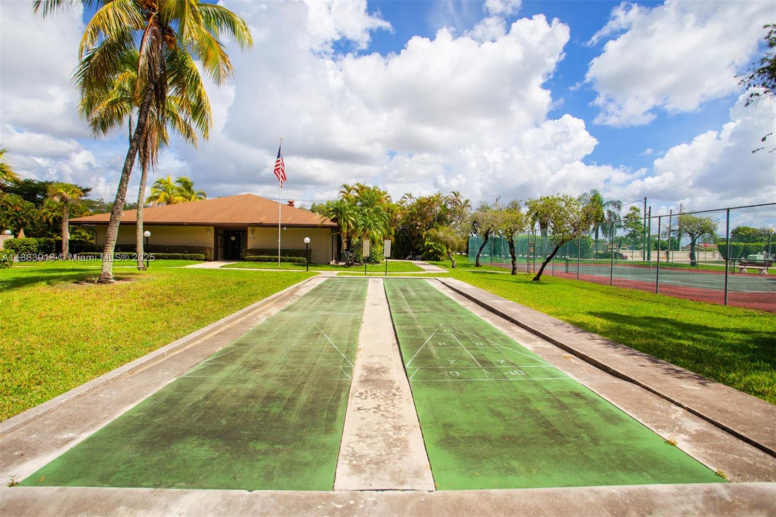 9711 West McNab Road, Unit 203 Tamarac, FL 33321 - Photo 35 of 37 a view of swimming pool with a garden and trees