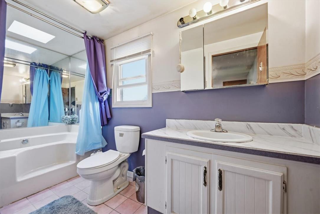 74 Swiss View Road Lehighton, PA 18235 - Photo 39 of 59 An inviting soaking tub pairs with a functional vanity in this practical bathroom space.