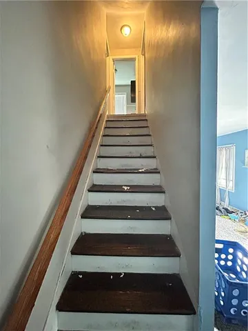 a living room with a couch and a window