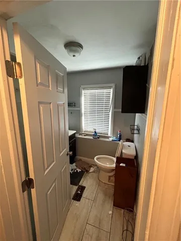a bathroom with a sink a toilet and a shower
