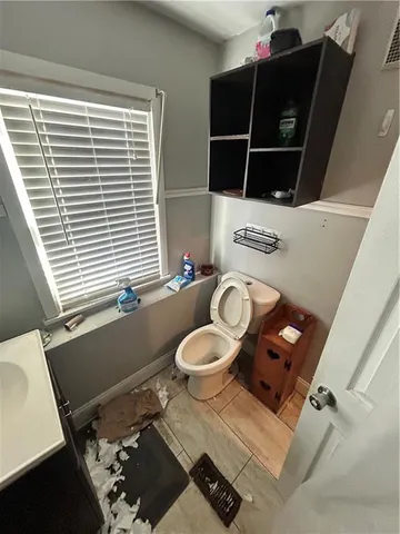 a bathroom with a shower and toilet