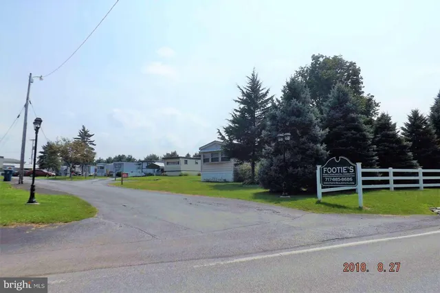 a view of a playground with basketball court