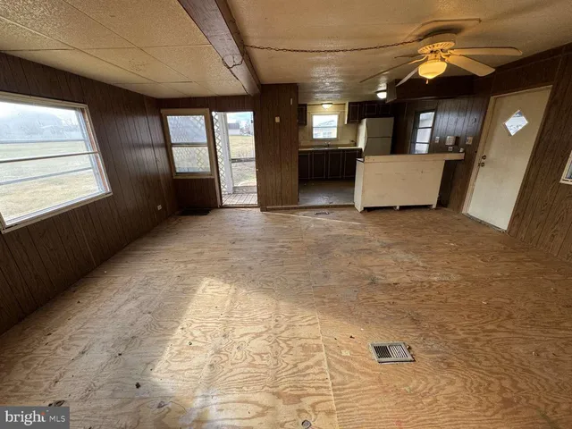 a view of a hallway with a window