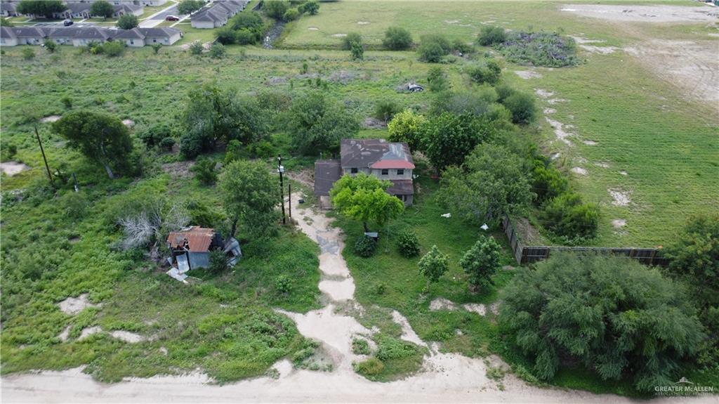 1524 West Hi Line Road Pharr, TX 78577 - Photo 13 of 34 a backyard of a house with a yard and outdoor seating