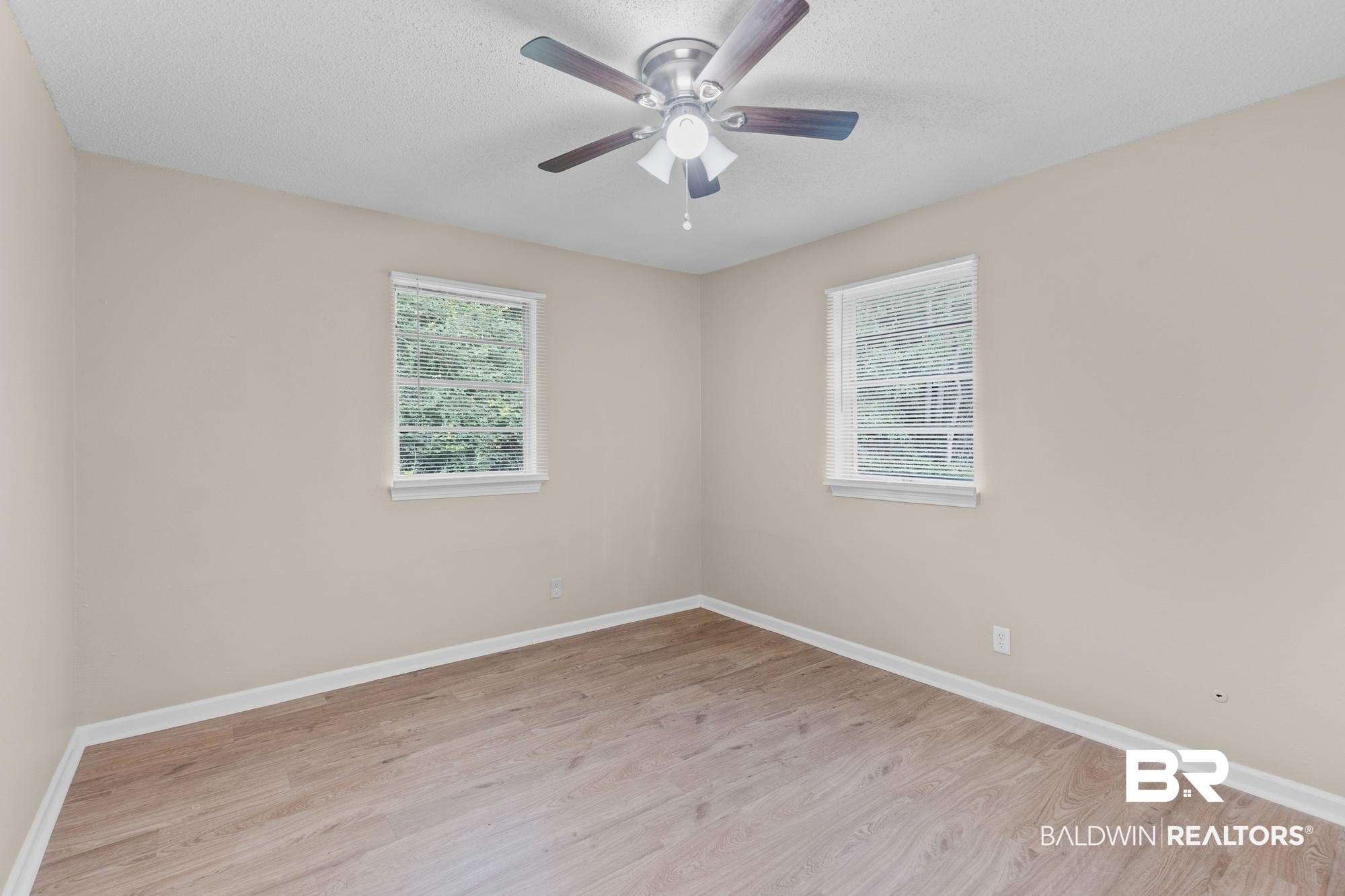 1560 Military Road Mount Vernon, AL 36560 - Photo 17 of 26 Neutral paint palette with wood-finish flooring