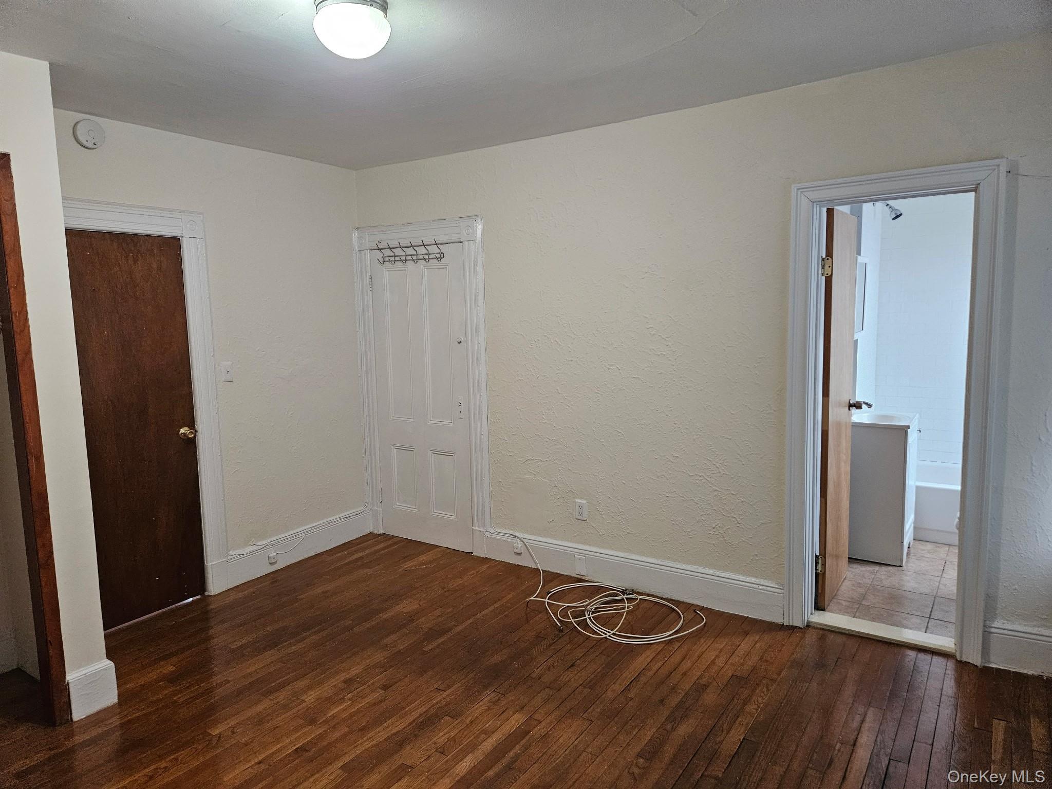 4759 Matilda Avenue, Unit 2 Bronx, NY 10470 - Photo 7 of 10 a view of an empty room with wooden floor