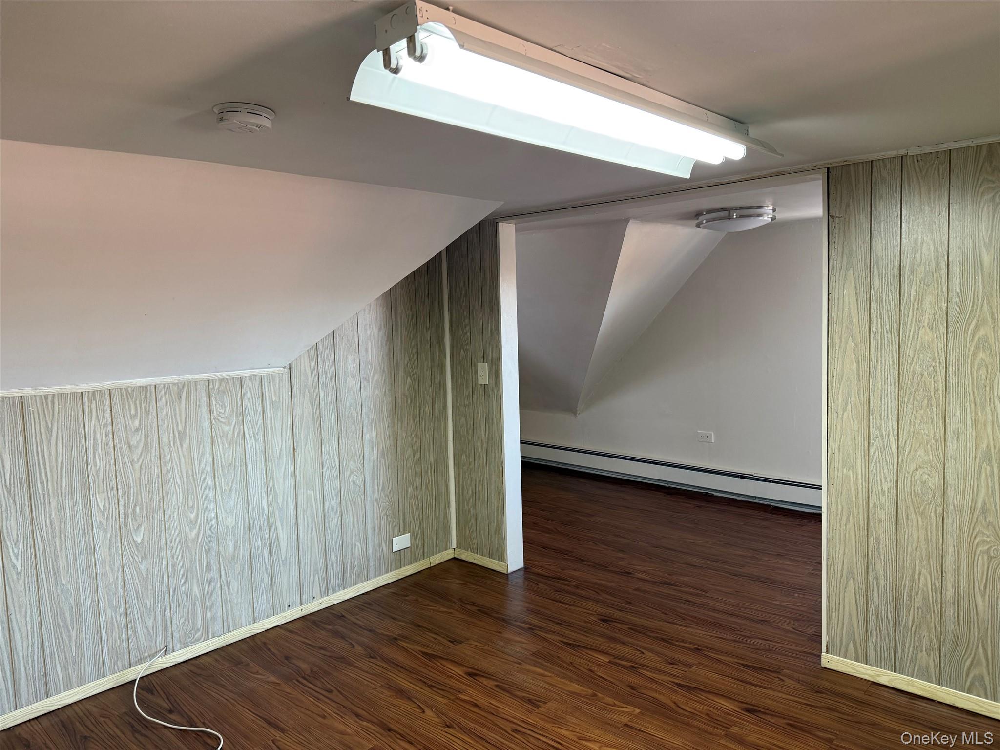 4759 Matilda Avenue, Unit 2 Bronx, NY 10470 - Photo 8 of 10 a view of an empty room with wooden floor