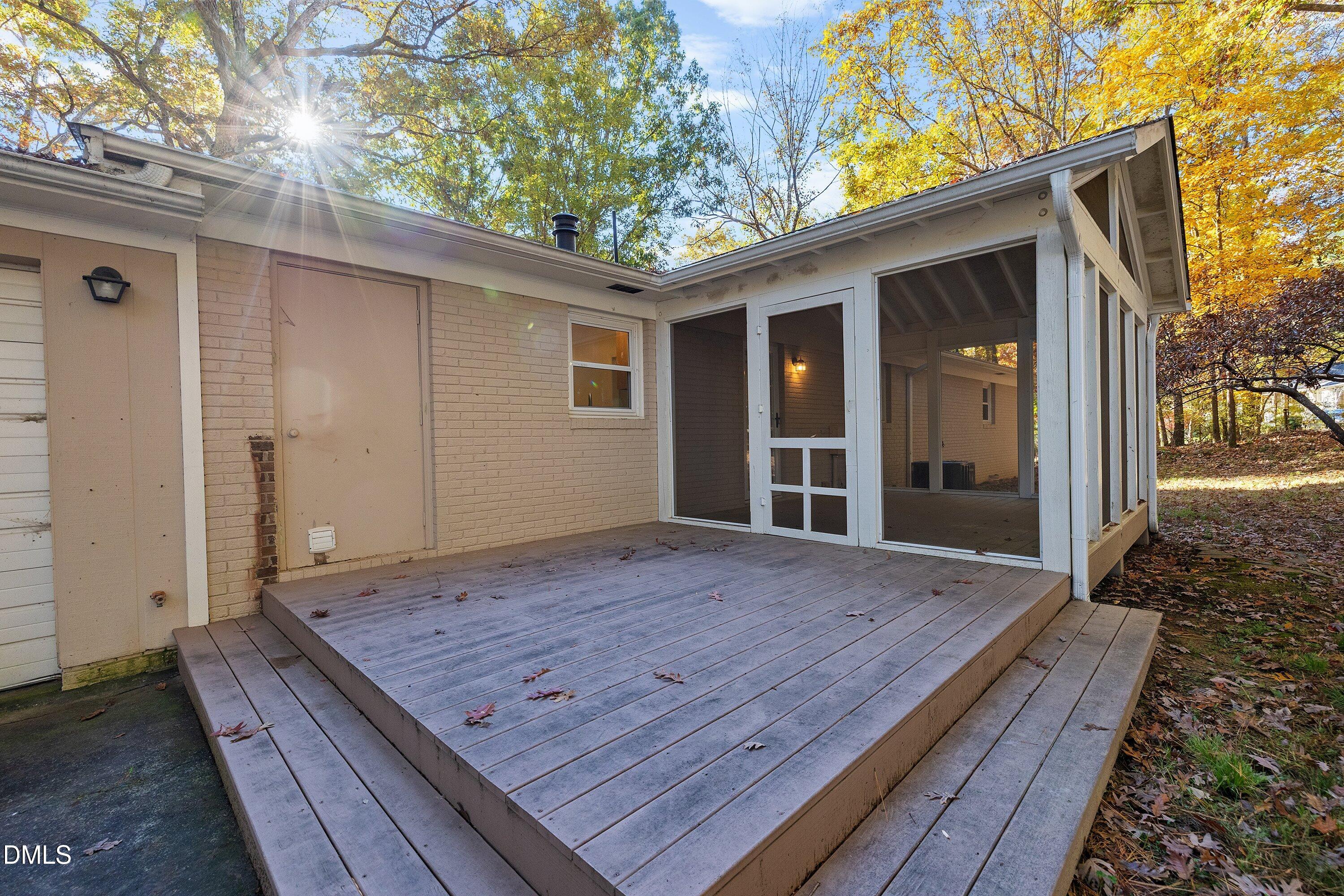 5917 Scalybark Road Durham, NC 27712 - Photo 34 of 47 a view of backyard with wooden floor and a large tree