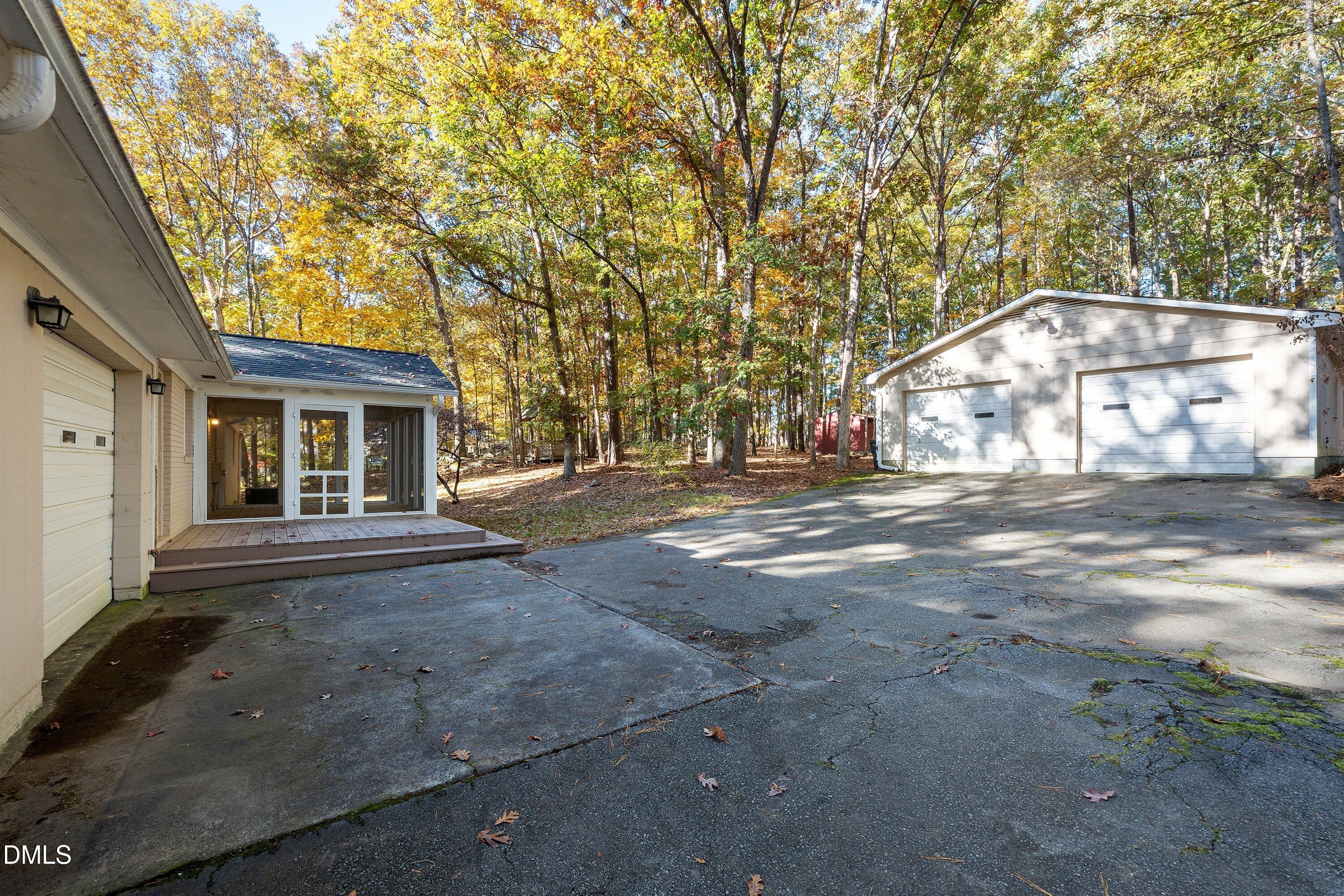 5917 Scalybark Road Durham, NC 27712 - Photo 36 of 47 a front view of a house with a yard and garage