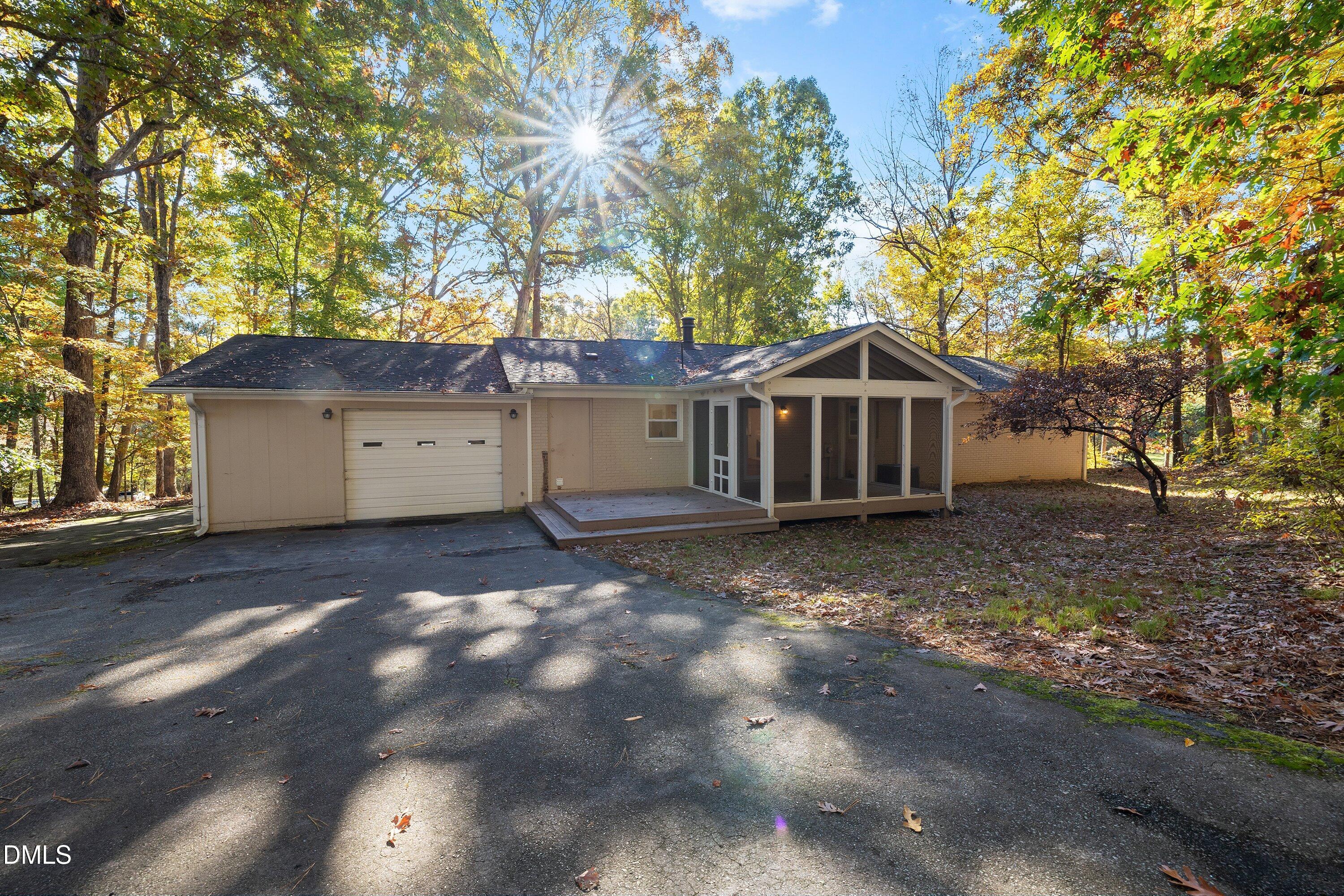 5917 Scalybark Road Durham, NC 27712 - Photo 37 of 47 a view of a house with a large tree and a yard