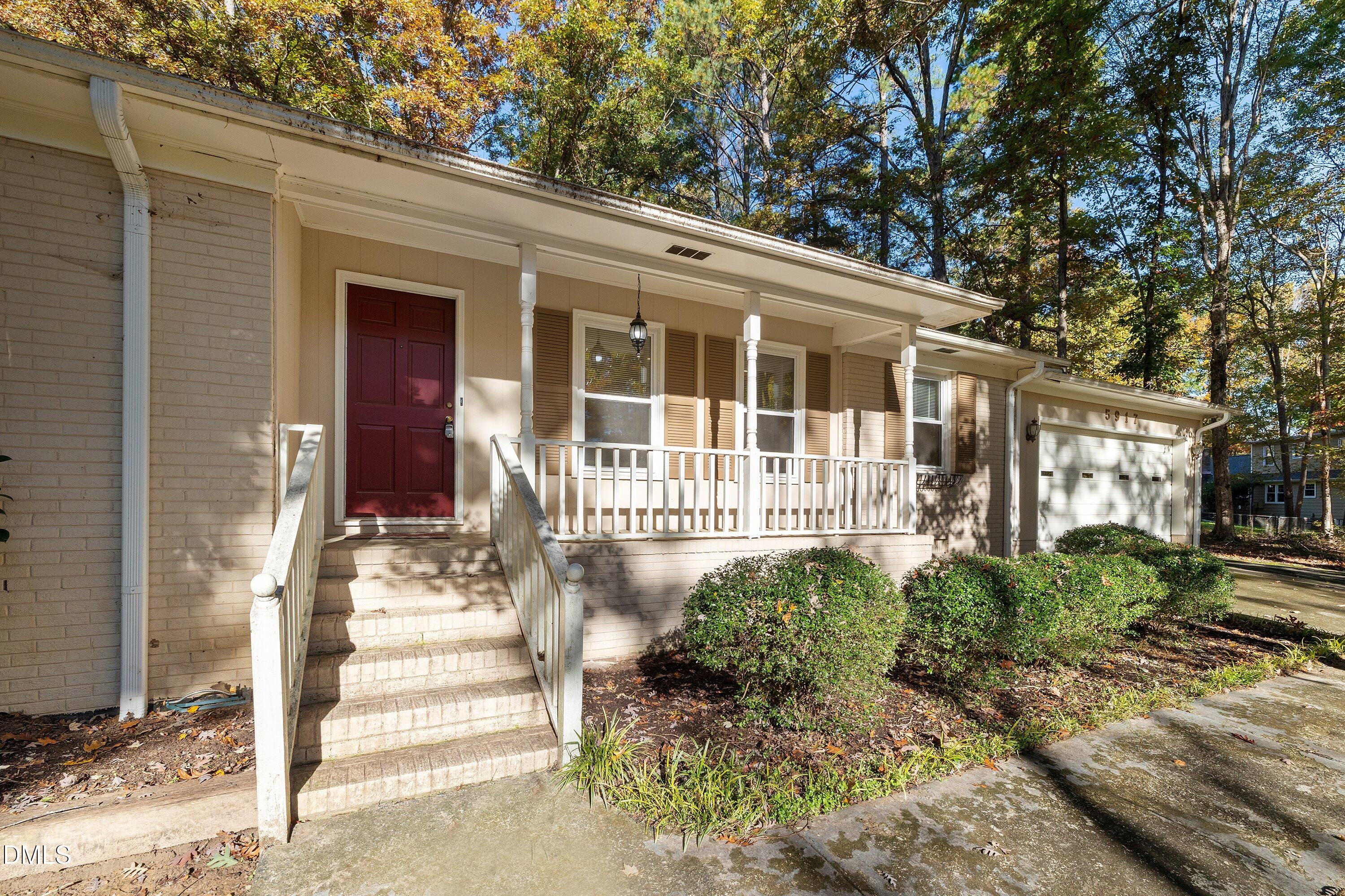 5917 Scalybark Road Durham, NC 27712 - Photo 6 of 47 a front view of a house with a garden