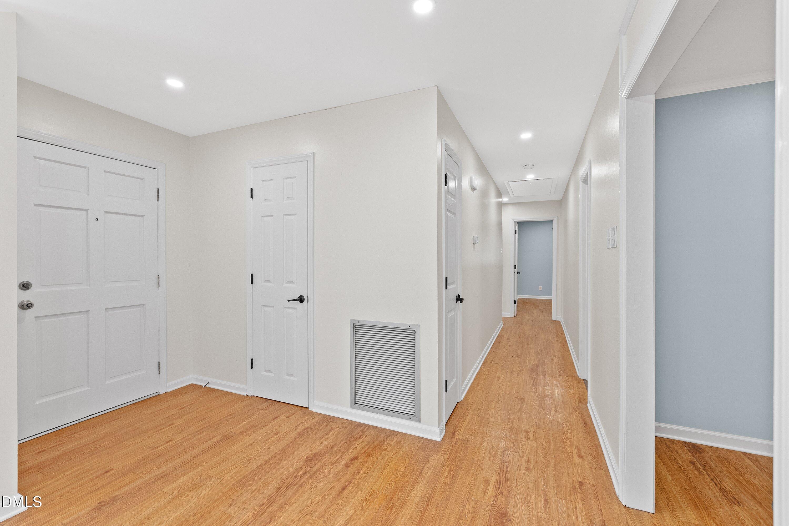 5917 Scalybark Road Durham, NC 27712 - Photo 7 of 47 a view of a room with wooden floor and staircase