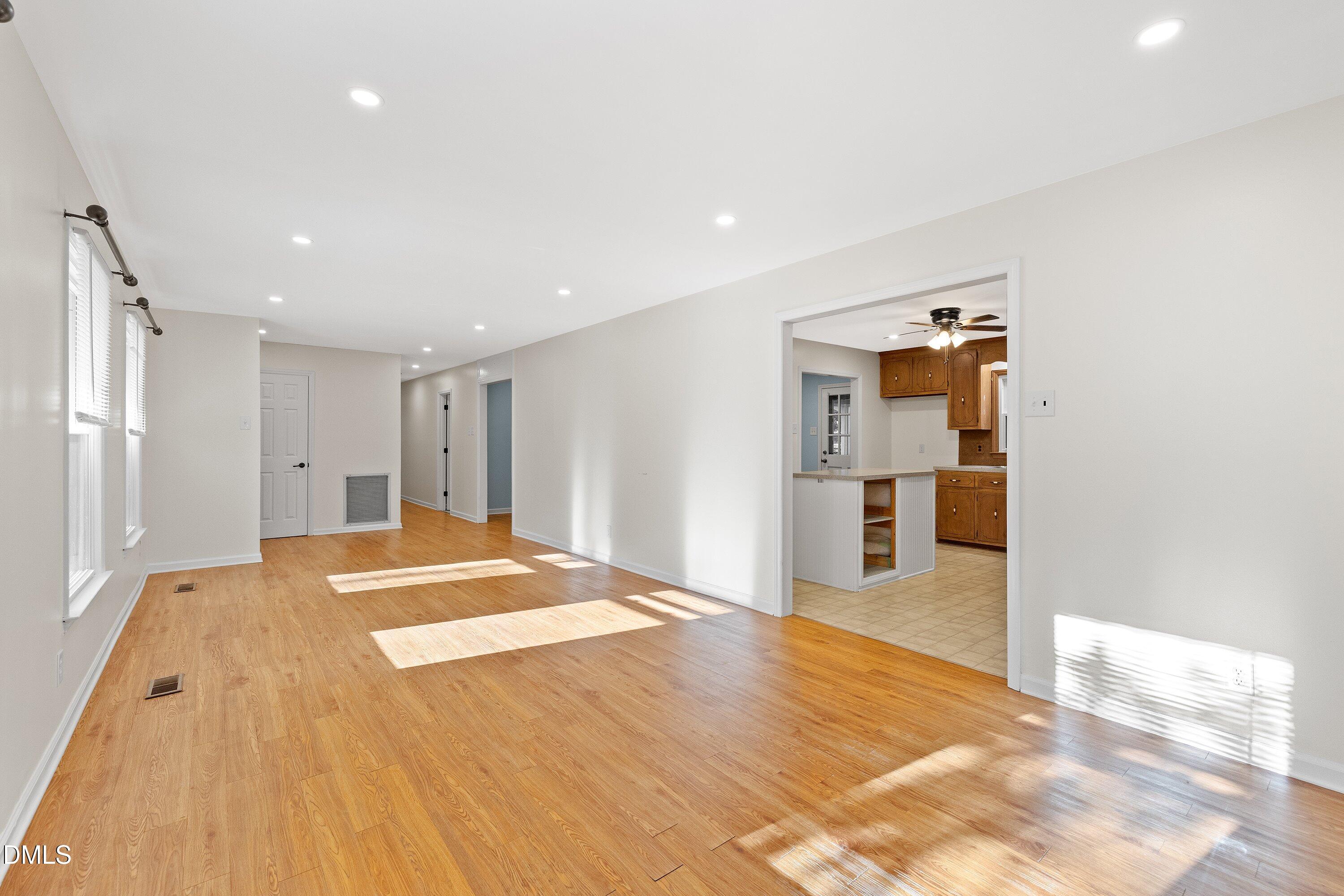 5917 Scalybark Road Durham, NC 27712 - Photo 10 of 47 a view of empty room with wooden floor