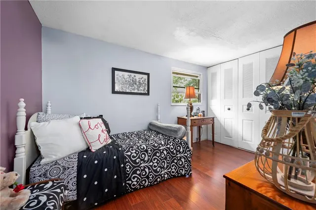 a bedroom with furniture and a chandelier
