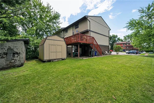 a view of a garden with a large tree