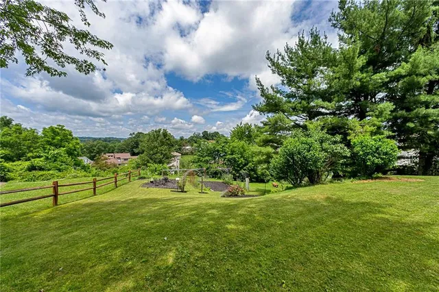 a view of a street with houses on both side