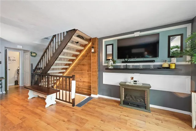 a view of a livingroom with furniture and a flat screen tv