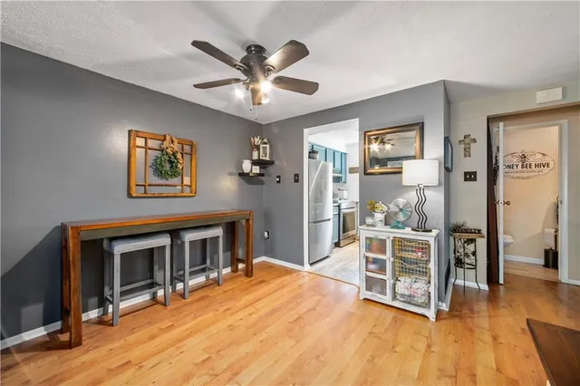 a bedroom with furniture window and wooden floor