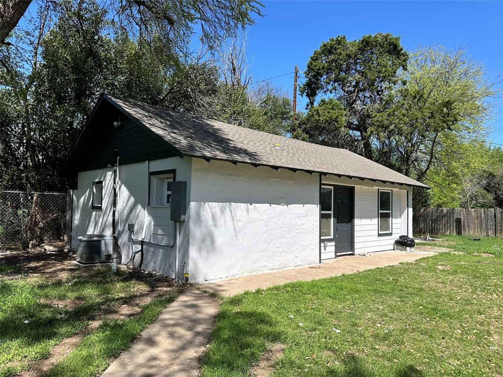 4101 North 19th Street Waco, TX 76708 - Photo 2 of 8 a front view of house with a garden and trees