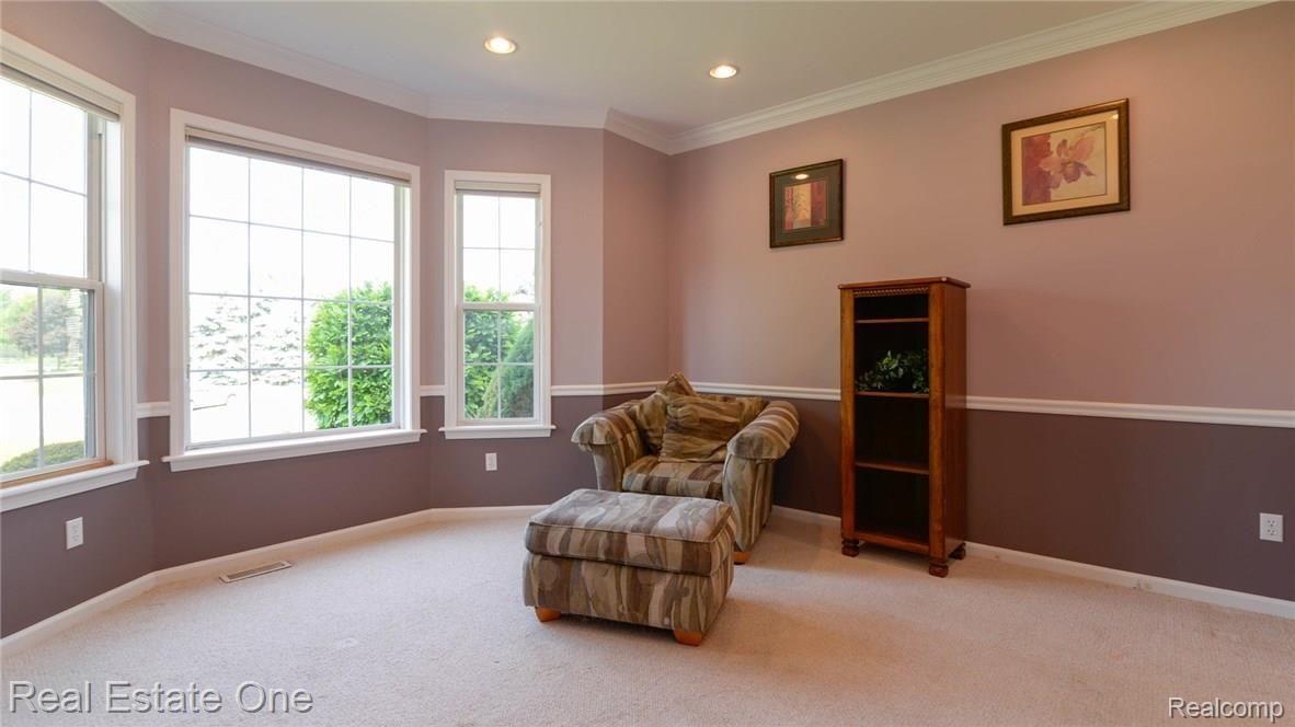 1824 Park Ridge Court Howell, MI 48843 - Photo 9 of 47 FRONT DEN/STUDY WITH LOVELY BAY WINDOW AND WOOD DETAIL.