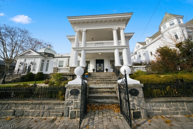 1 Hamilton Avenue Weehawken, NJ 07086 - Photo 2 of 40 a view of a house with backyard porch and sitting area