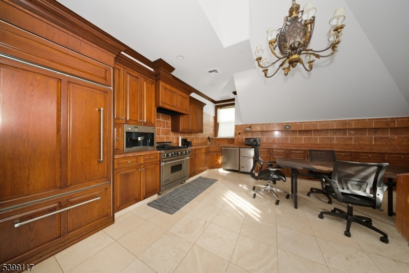 1 Hamilton Avenue Weehawken, NJ 07086 - Photo 36 of 40 a kitchen with a refrigerator and a sink