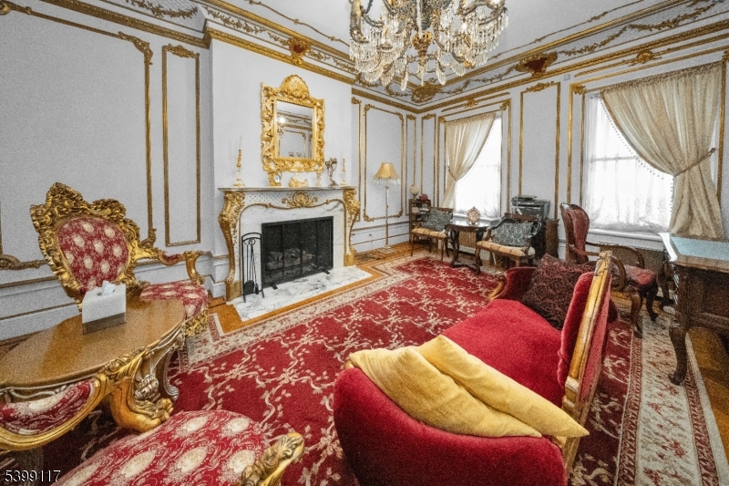 1 Hamilton Avenue Weehawken, NJ 07086 - Photo 7 of 40 a living room with furniture windows and a fireplace