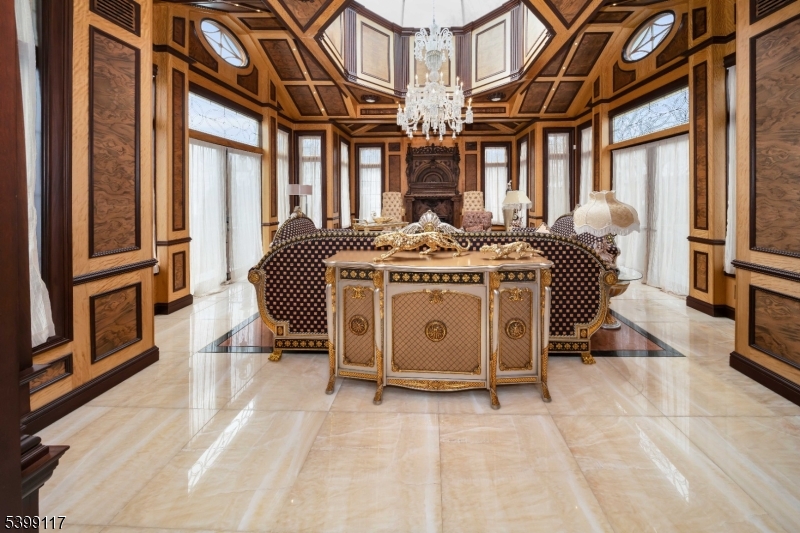 1 Hamilton Avenue Weehawken, NJ 07086 - Photo 10 of 40 a utility room with stainless steel appliances granite countertop a stove and a refrigerator