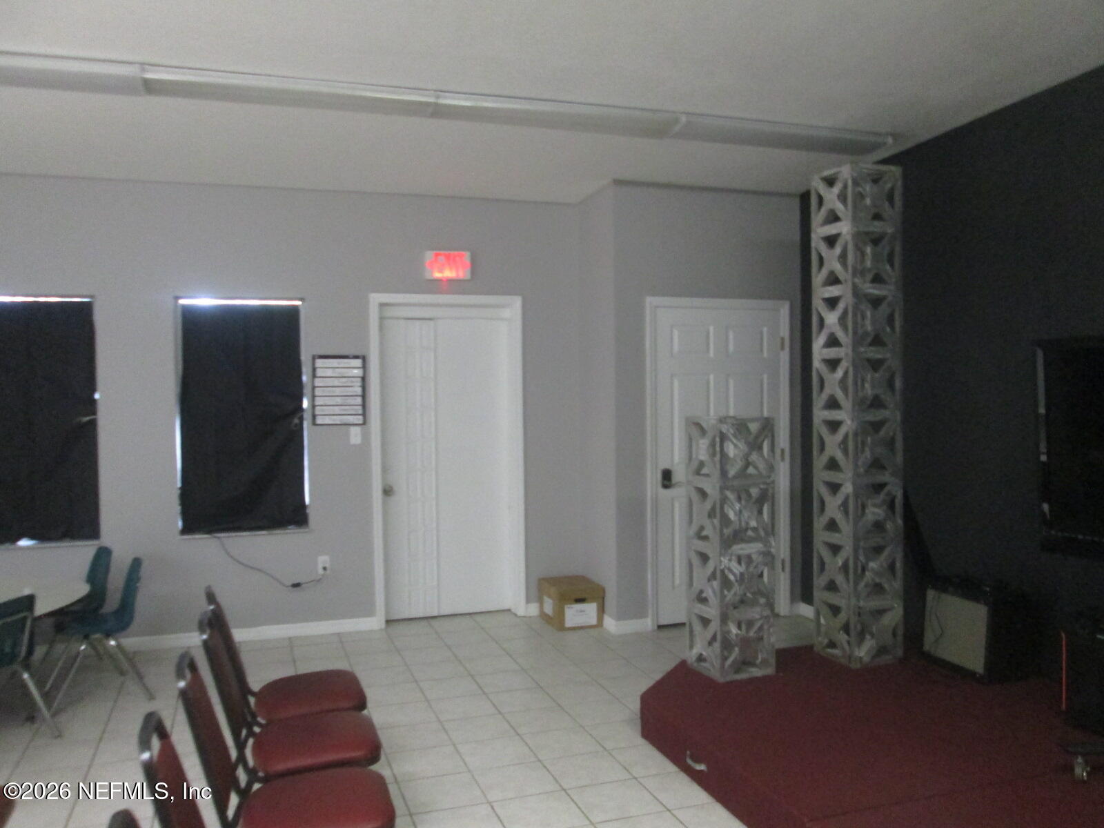 555 Highway 16 St. Augustine, FL 32084 - Photo 18 of 60 a living room with furniture and a flat screen tv
